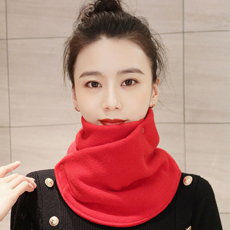 a woman with a red scarf around her neck