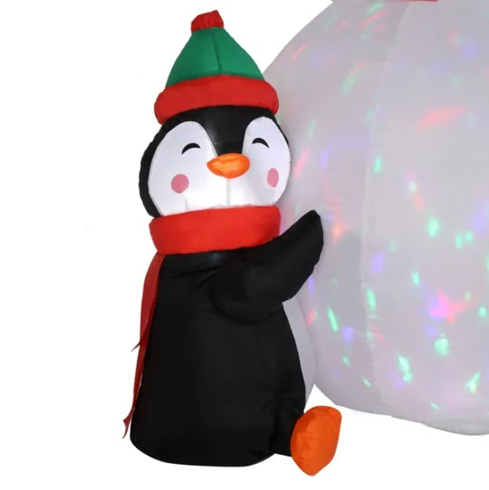 a large inflatable penguin with a white ball