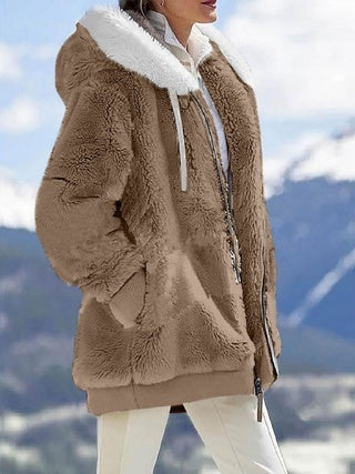 a woman in a brown coat