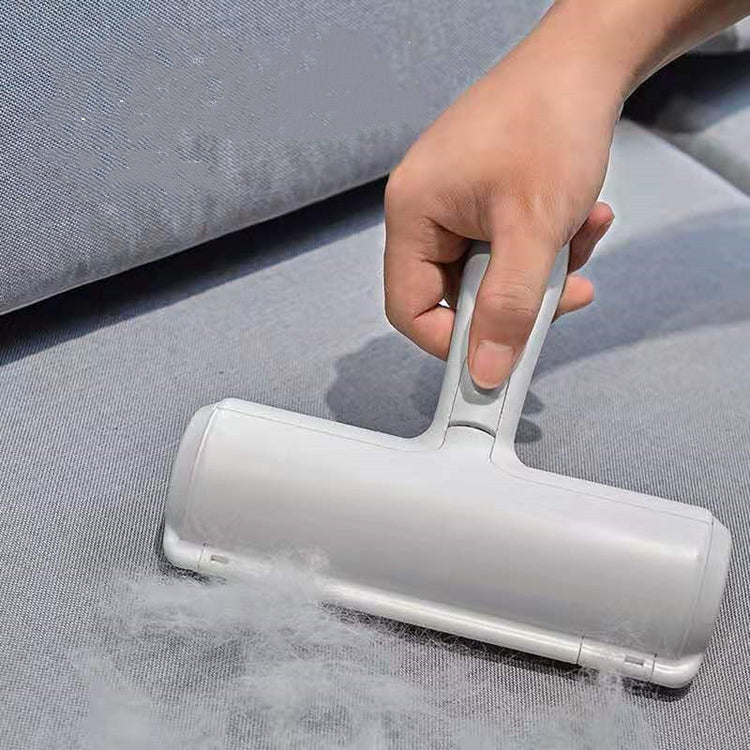 a hand holding a vacuum cleaner