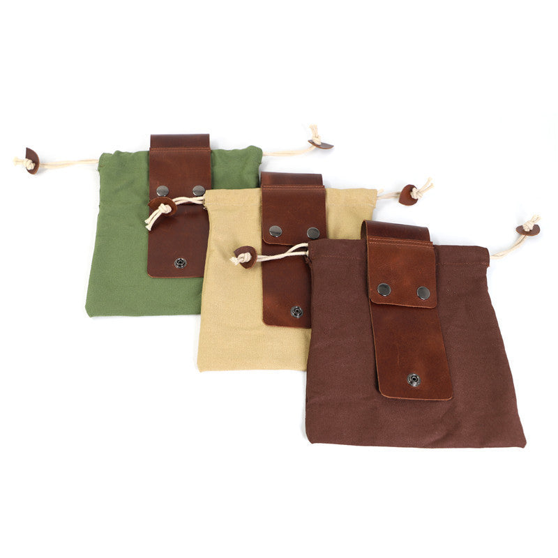 a group of small bags with leather straps