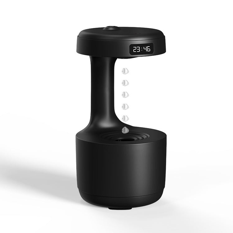a black device with a clock and water droplets