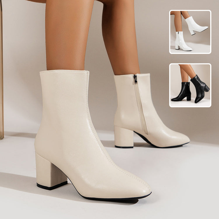 a woman's legs wearing white boots
