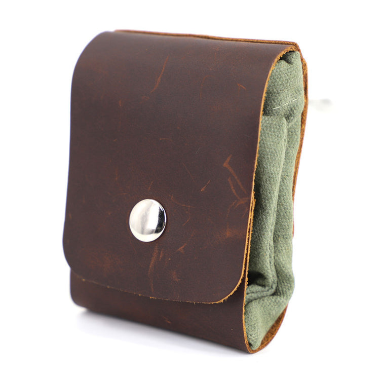 a brown leather wallet with a silver button