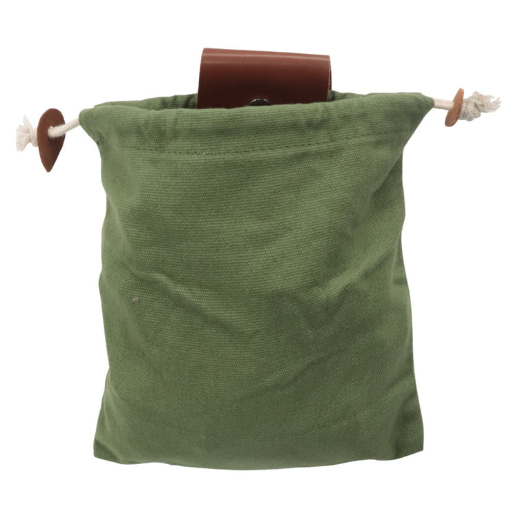 a green bag with a brown object in it