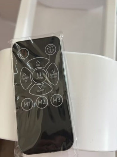 a remote control in a plastic wrap