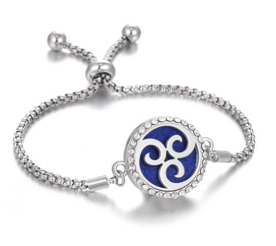 a silver bracelet with a blue circle with a white circle with a blue circle with a white circle with a blue circle with a white circle with a white circle with a white circle with a white circle