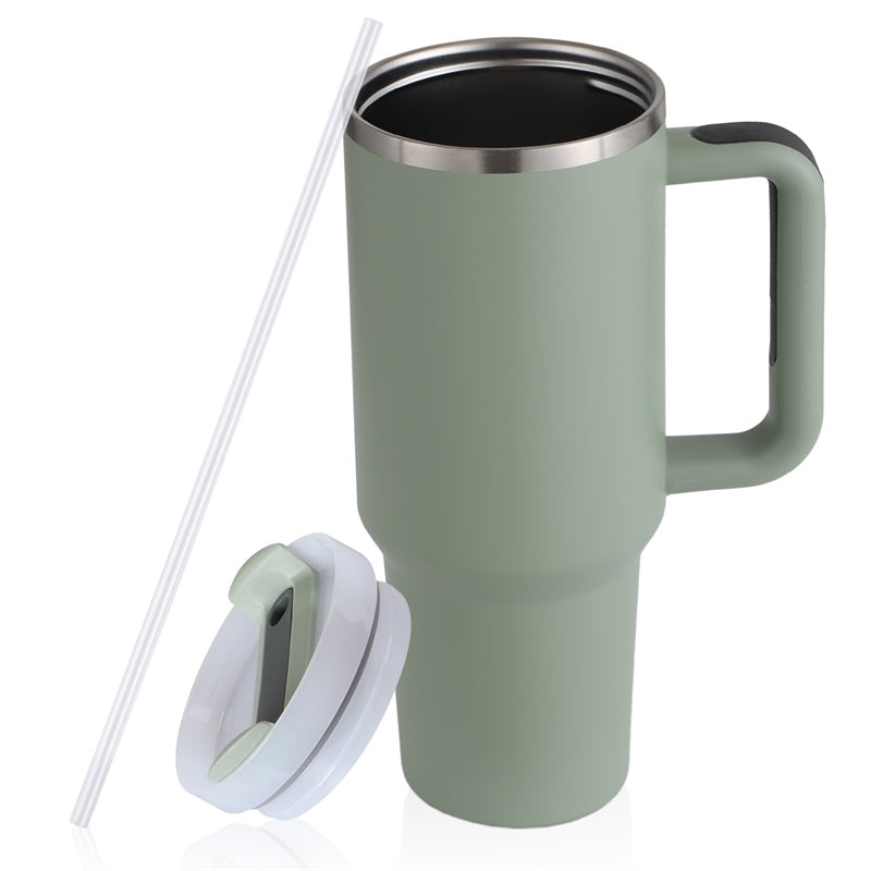 a green coffee mug with a straw and lid