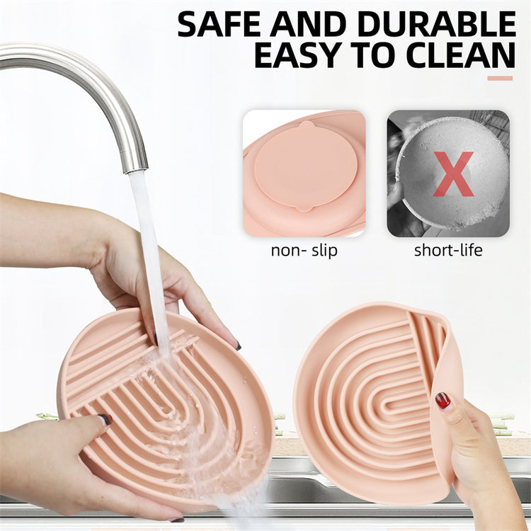 a person washing dishes with a faucet