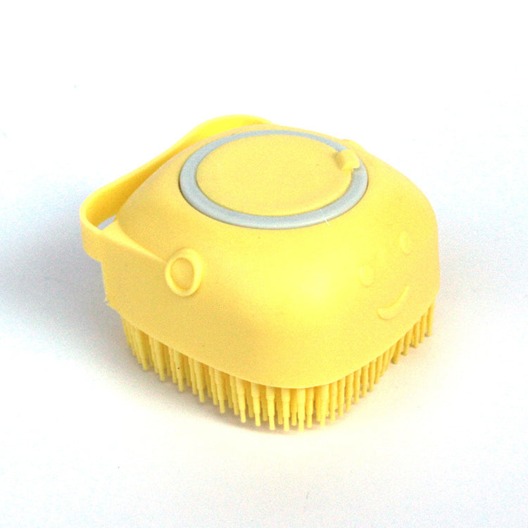 a yellow brush with a face