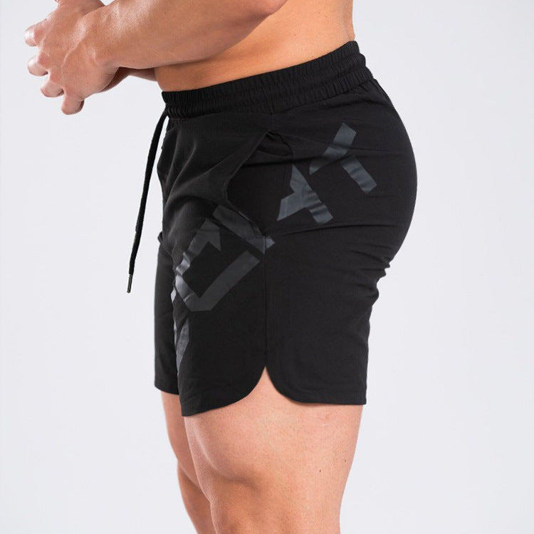 a man wearing black shorts