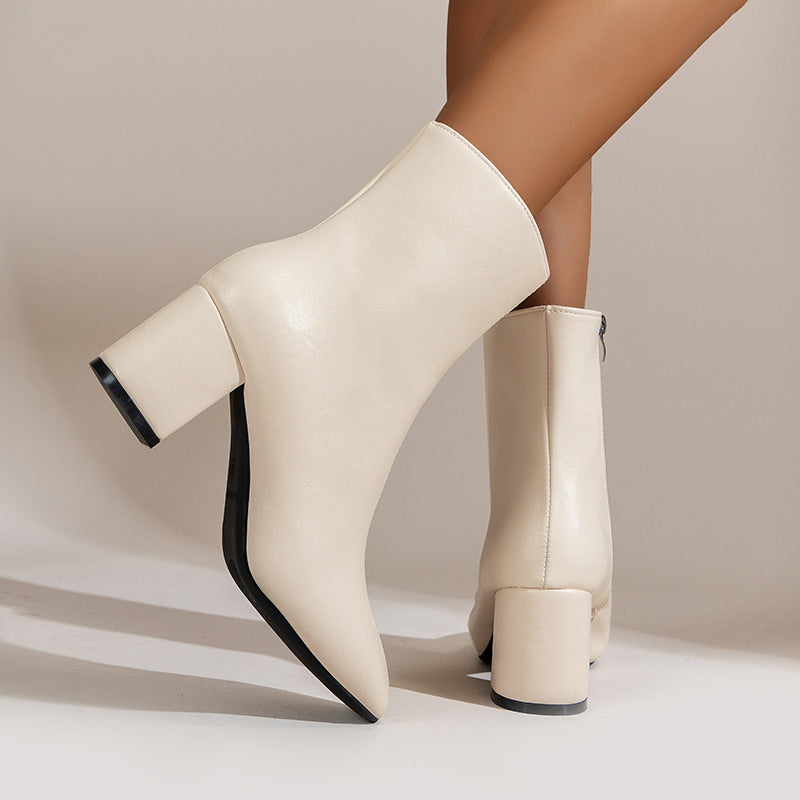 a pair of white boots