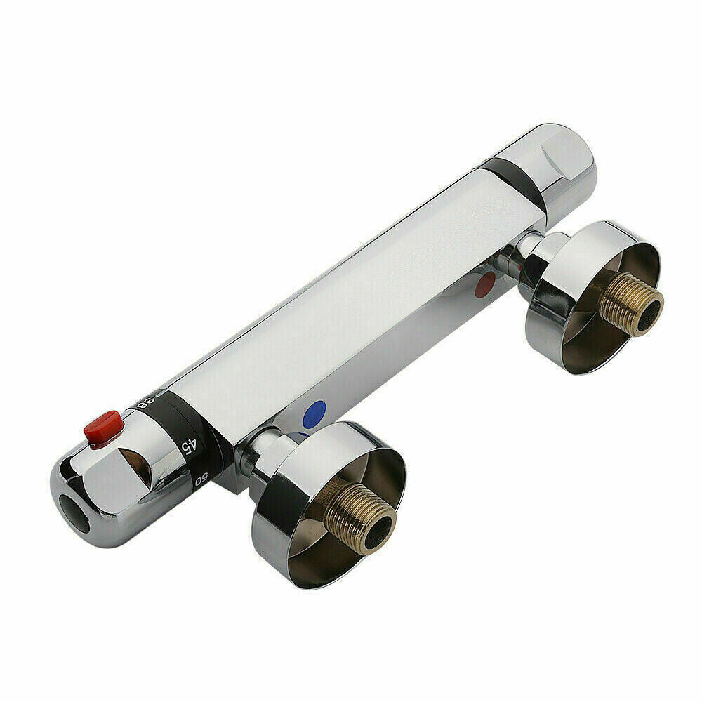 a silver faucet with red button
