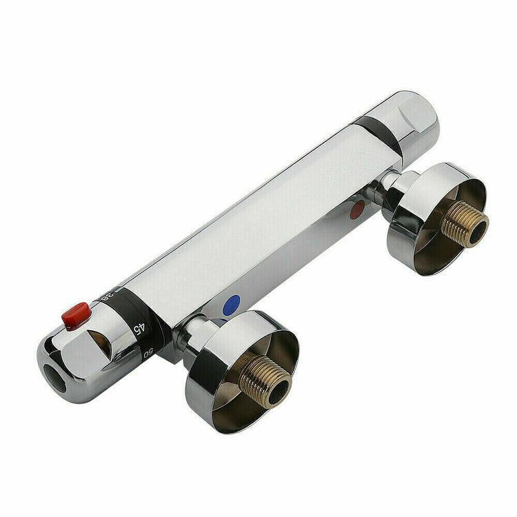 a silver faucet with red button