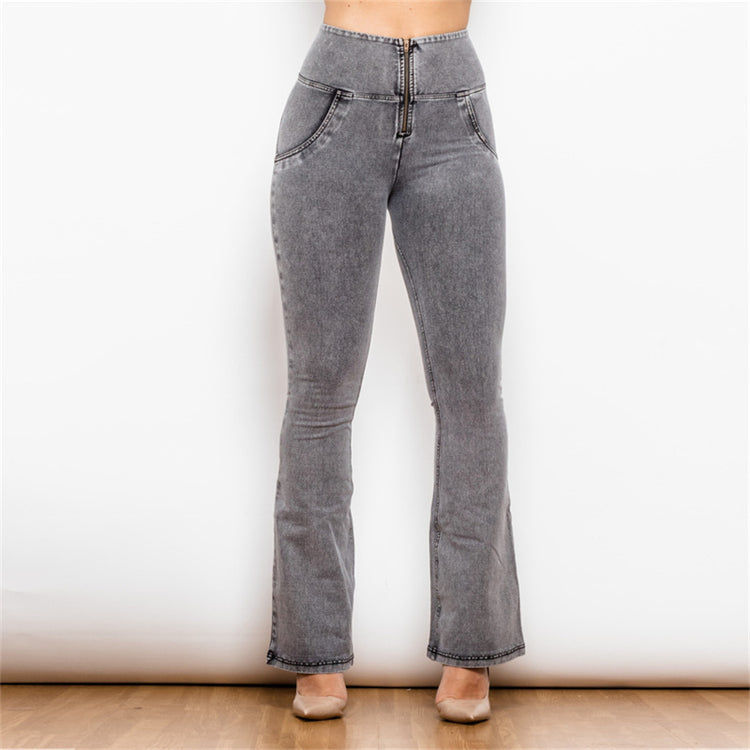 a woman wearing grey jeans