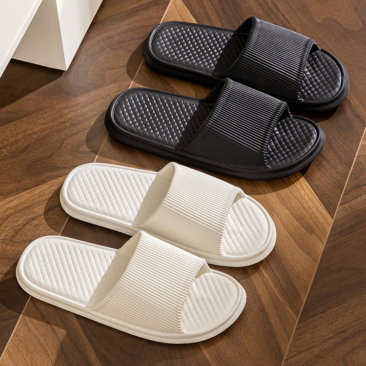 a group of black and white slippers