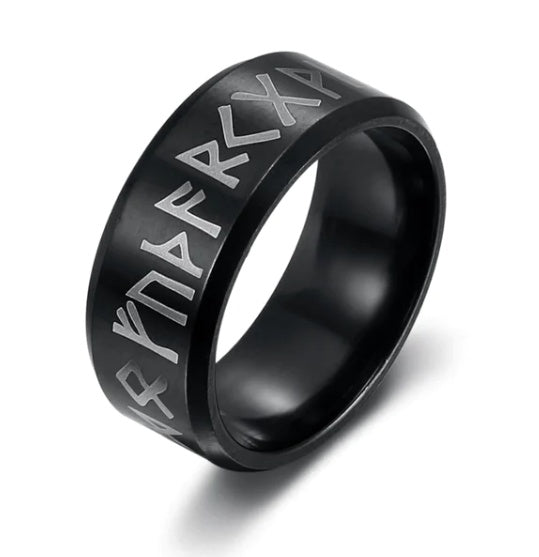 a black ring with silver engraved letters