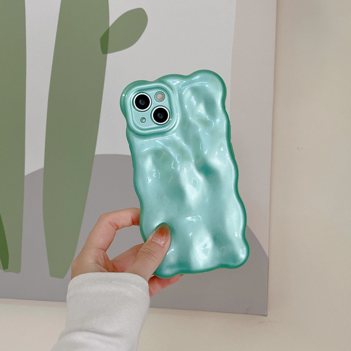 a hand holding a phone