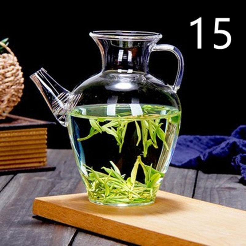 a glass jar with liquid and leaves in it