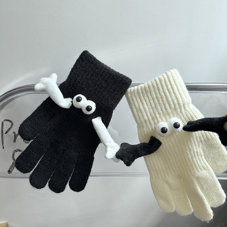 a pair of gloves with eyes and nose