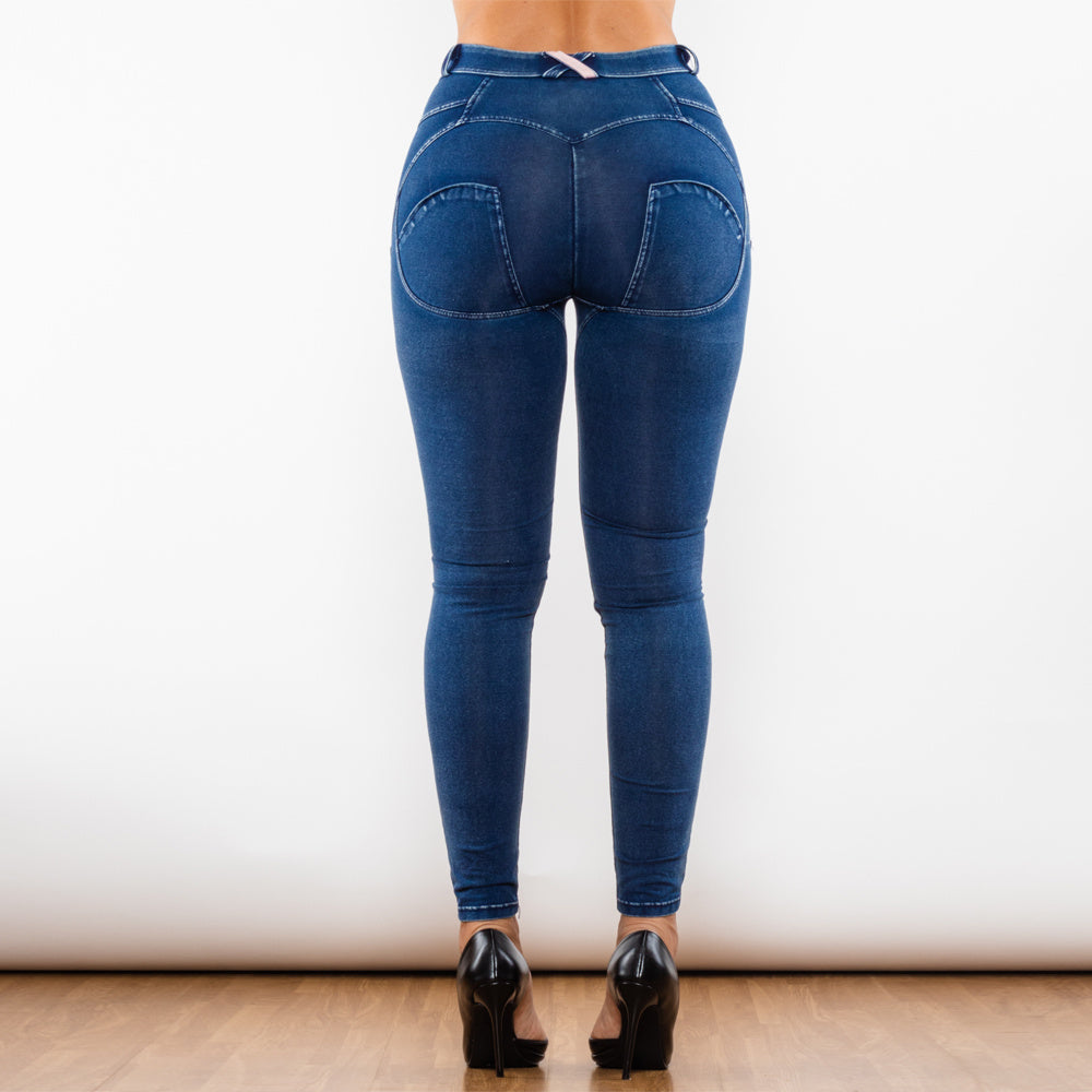a woman wearing jeans and high heels
