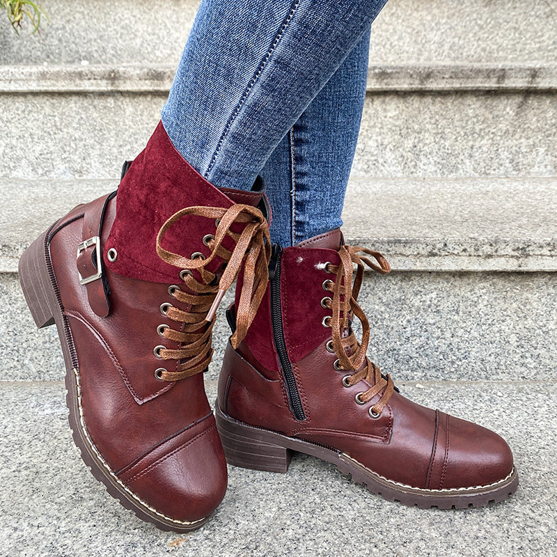 a person's legs wearing brown boots