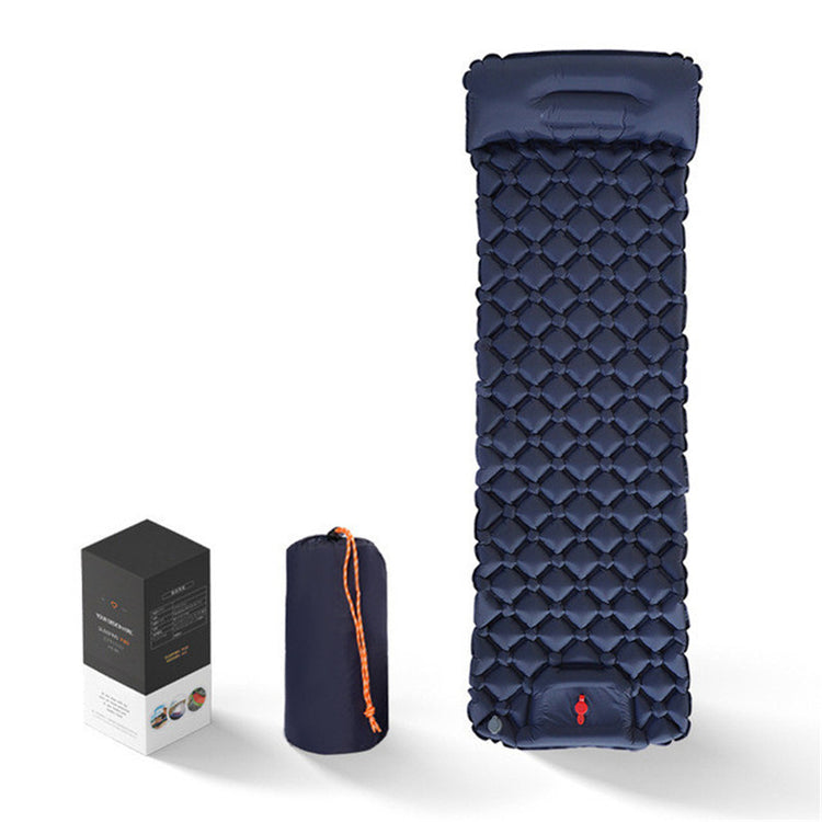 a blue camping mat next to a box