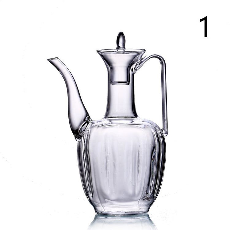 a glass jug with a handle