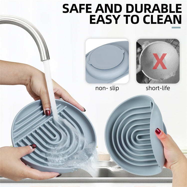 a person washing dishes with water