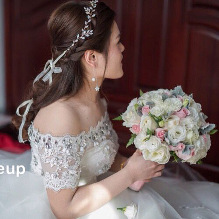 a woman in a wedding dress holding a bouquet