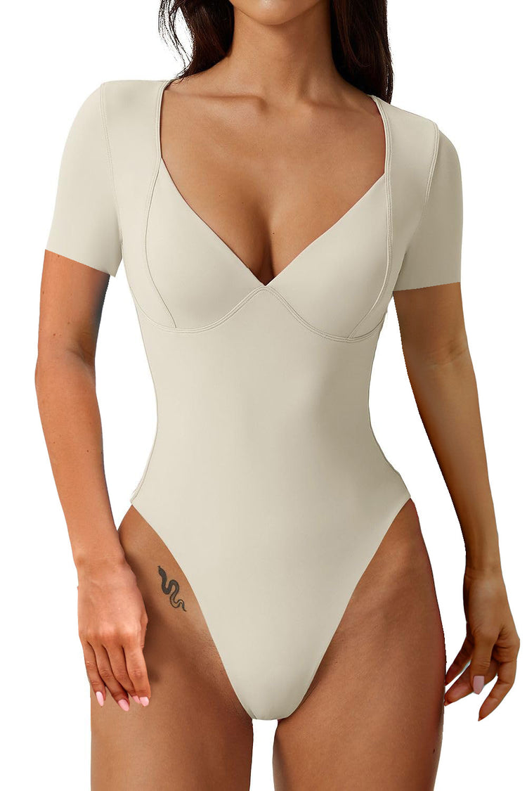 a woman wearing a white bodysuit