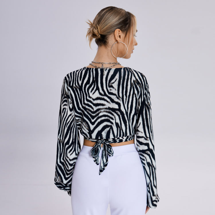 a woman in a zebra print shirt