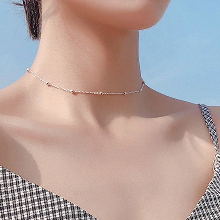 a woman wearing a necklace