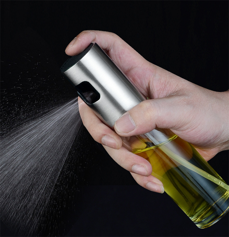 a hand holding a spray bottle