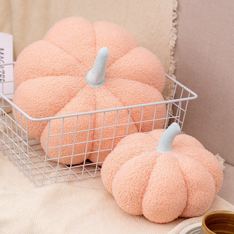 a two pumpkins in a wire basket