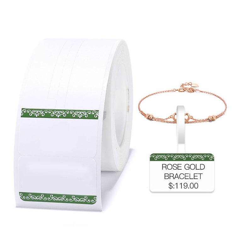 a roll of white paper with a gold bracelet and a price tag