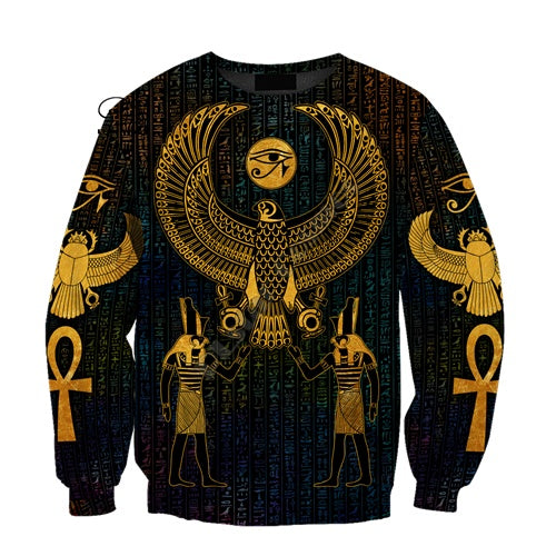 a black and gold sweater with egyptian symbols