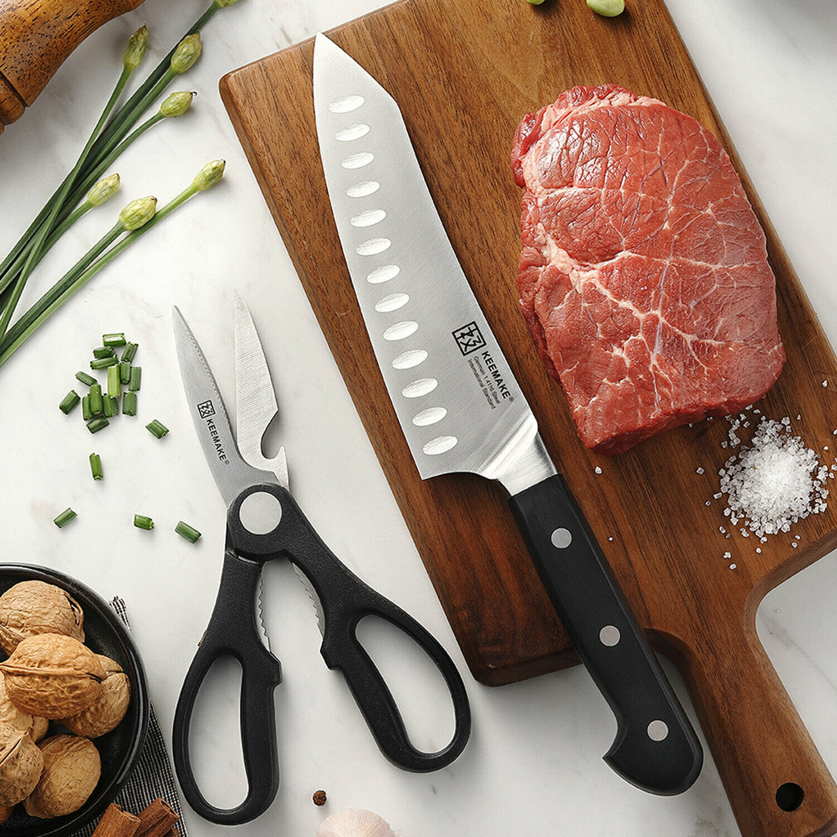 a knife and meat on a cutting board