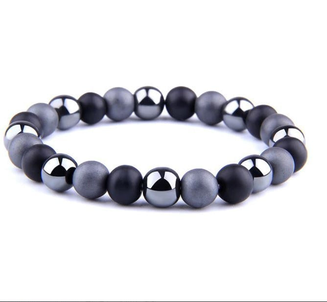 a bracelet with black and grey beads