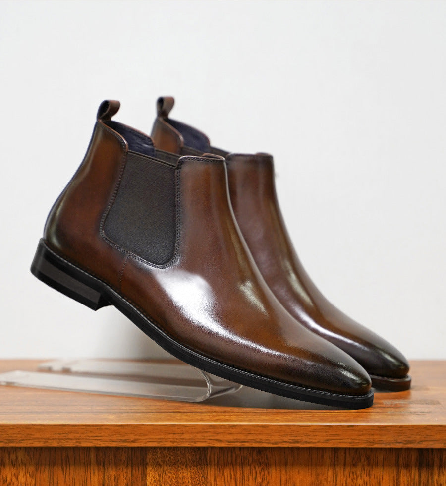a pair of brown leather shoes on a stand