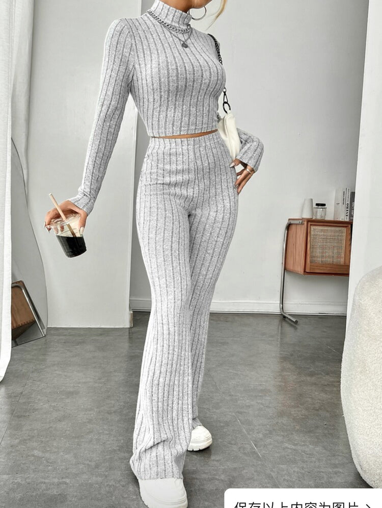 a woman in a grey outfit