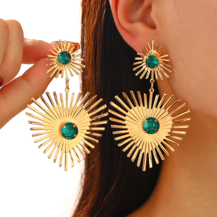 a woman wearing a pair of earrings