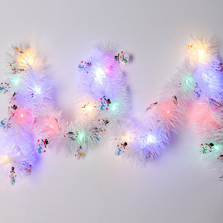 a white garland with lights on it