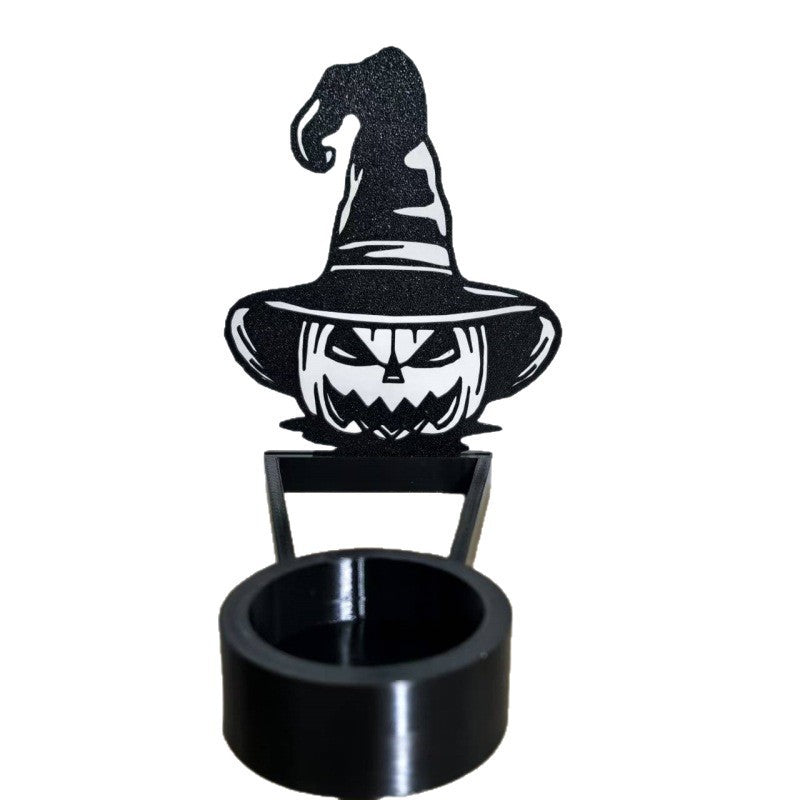 a black object with a pumpkin face