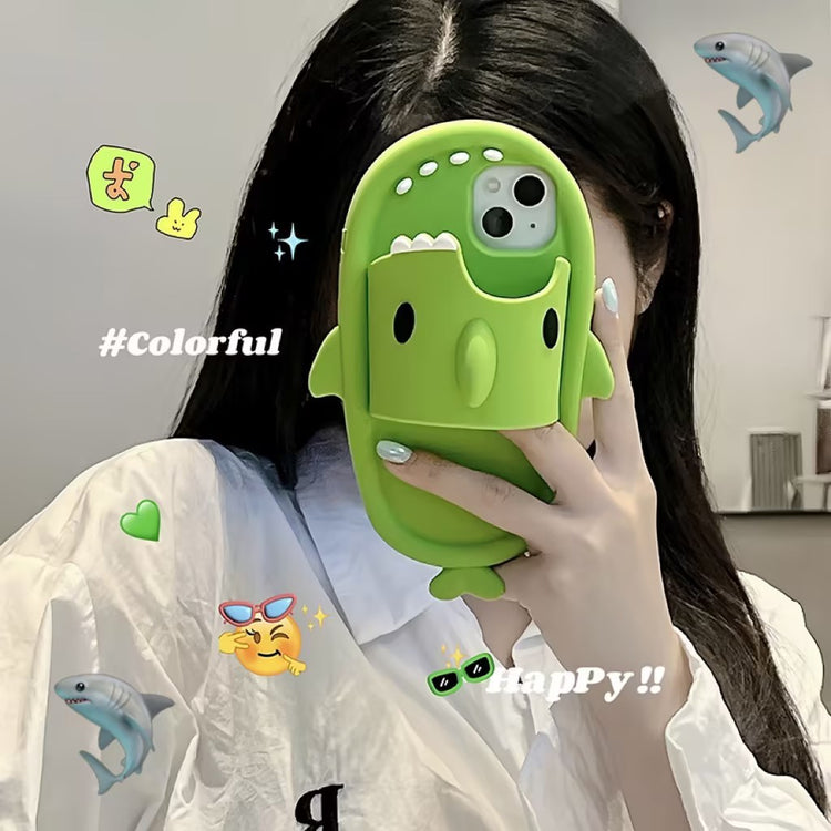 a woman holding a green phone