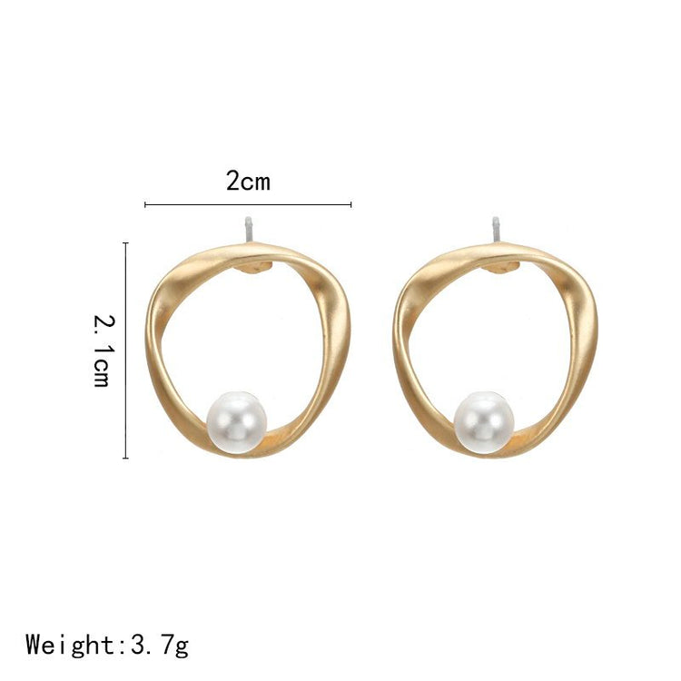 a size of earrings with a pearl in the middle