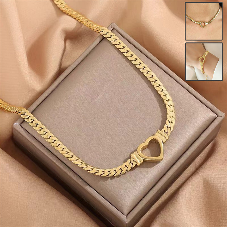 a gold chain with a heart in it