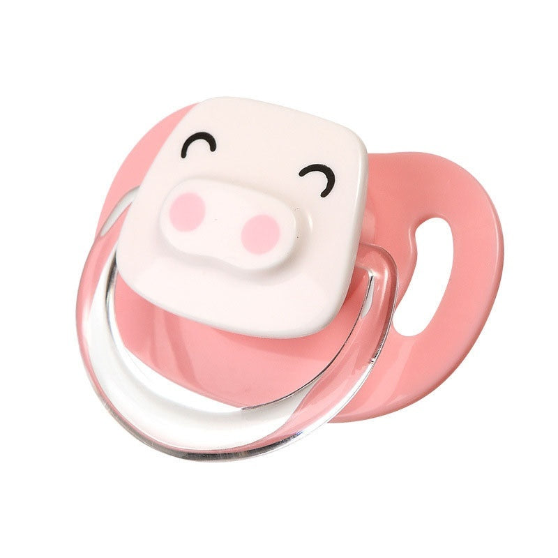 a pink pacifier with a pig face