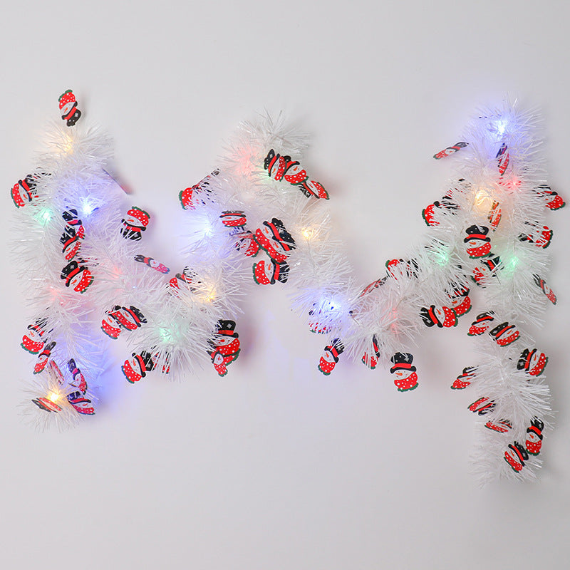 a group of ladybugs on a white garland