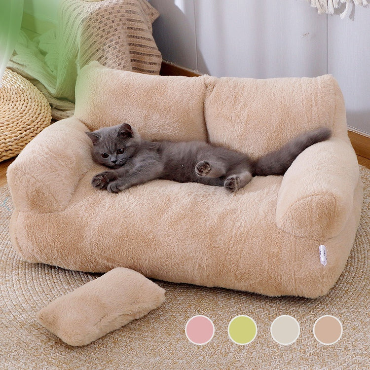 a cat lying on a couch